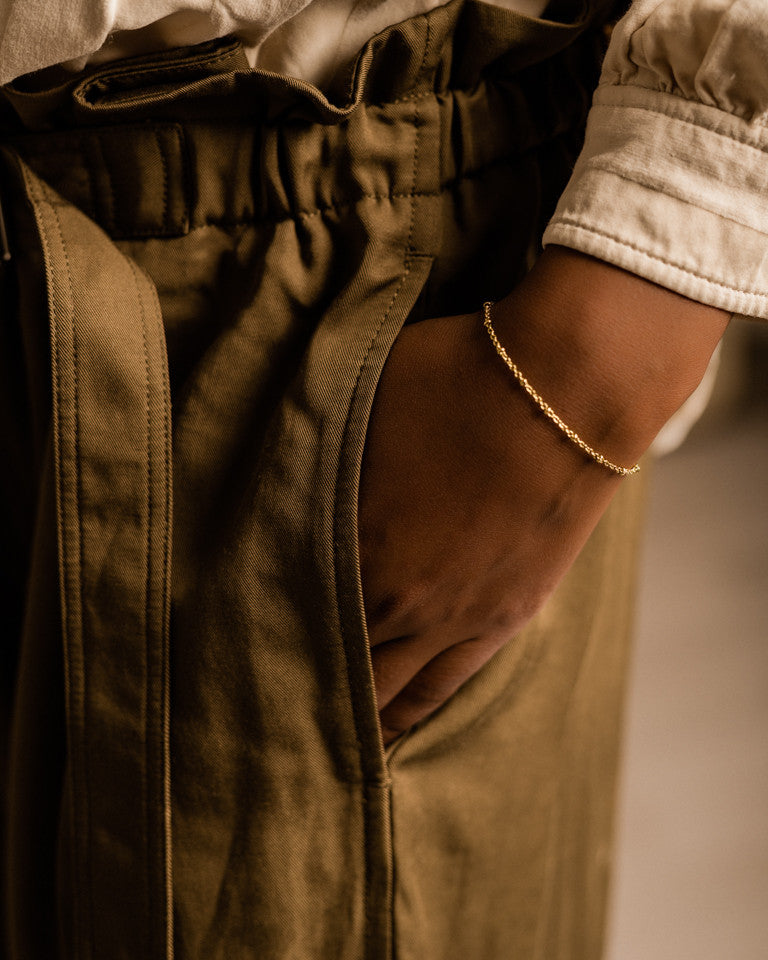 Ball bracelet in gold on model