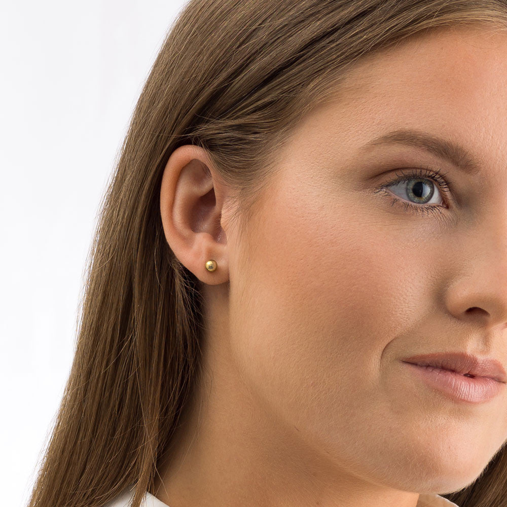 Golden Titanium Ball Earrings on Model