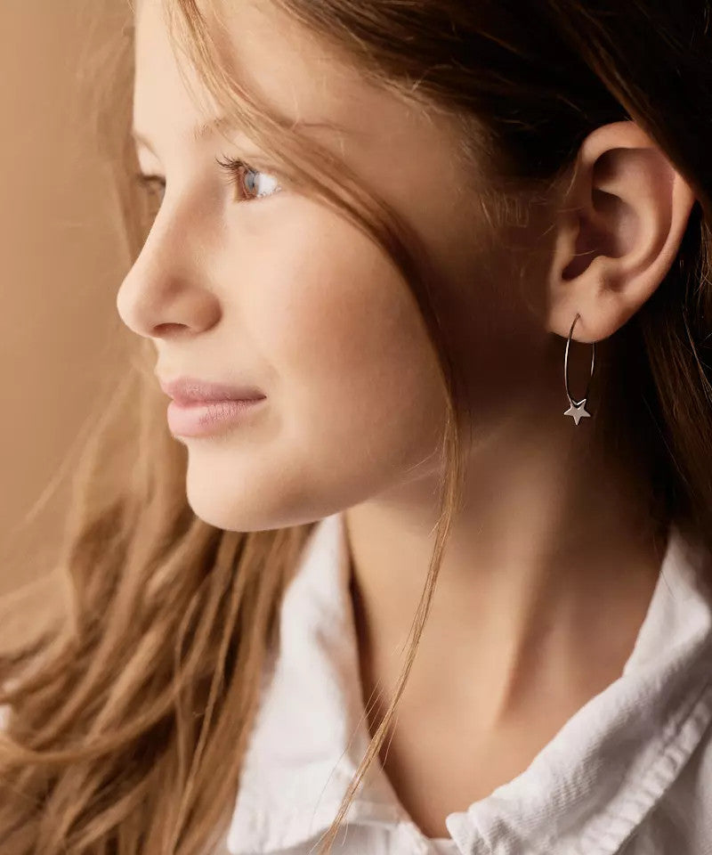 Star earring on model