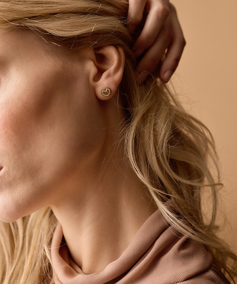 Golden titanium Brilliance Sweetheart earrings on model