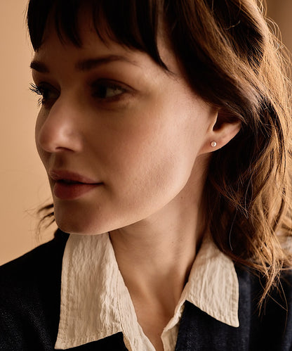 Model wearing Allergy-Safe 4mm Natural Titanium Light Rose Pearl earrings
