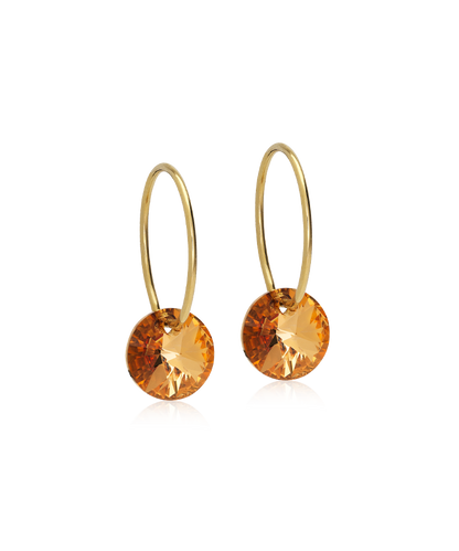 Gold hoop earrings with bronze gemstones on a white background