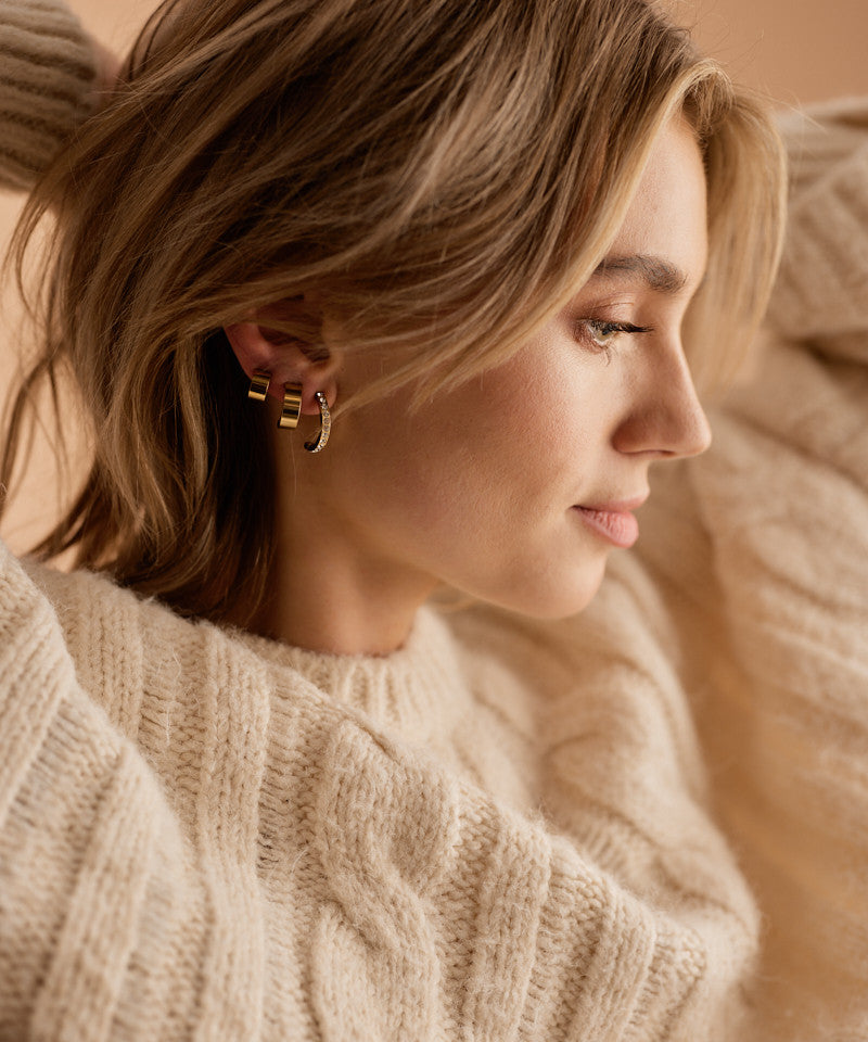 Model wearing Golden Titanium 20mm Brilliance Curved Pendant