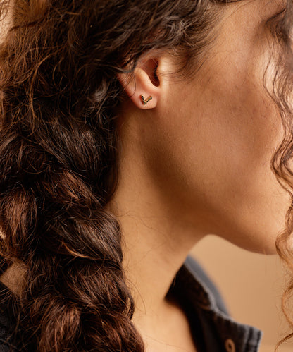 Model wearing Golden Titanium Brilliance V 8mm Black Earrings
