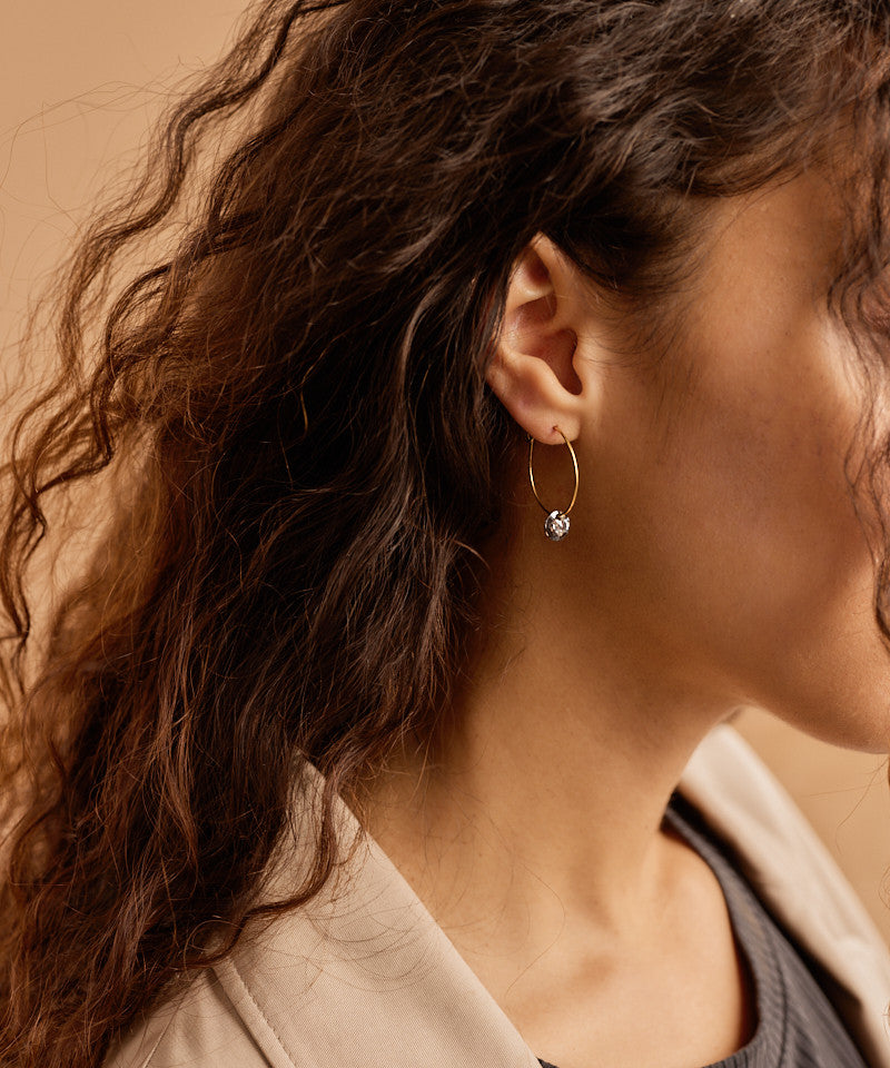 Model wearing Golden Titanium Black Diamond Round Pendant 25mm Ear Ring