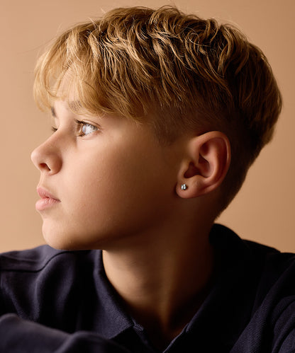 Model Wearing Golden Titanium 5mm Prong Set Edge Aquamarine CZ Earrings