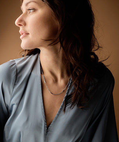 Silver colored Grace hypoallergenic necklace on model