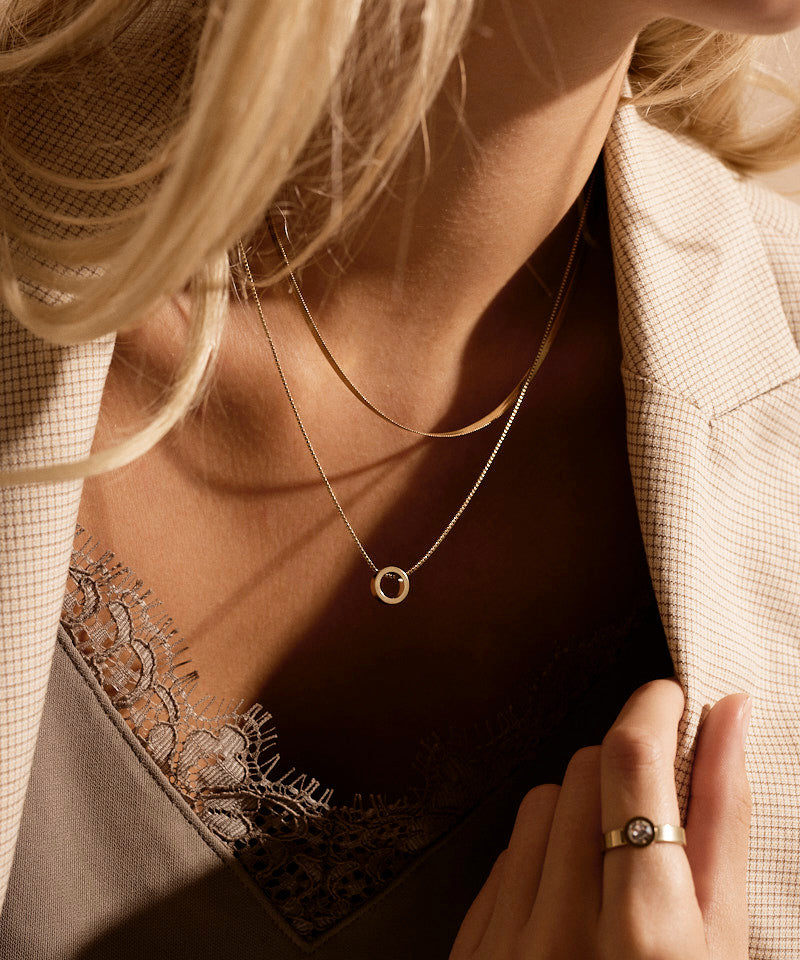 Golden Puck Hollow Necklace Pendant on model