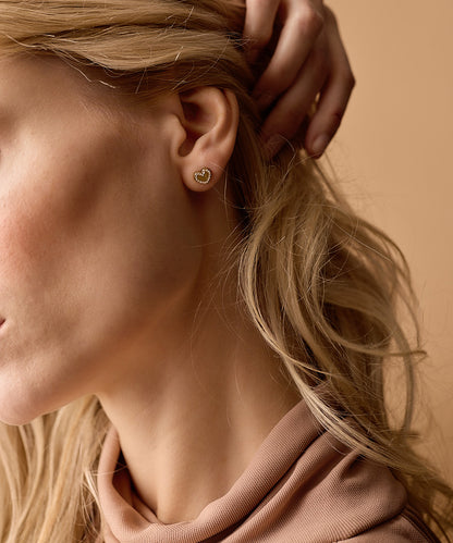 Golden titanium Brilliance Sweetheart earrings on model
