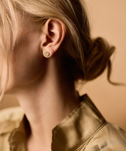 Golden titanium Brilliance Sweetheart earrings on model