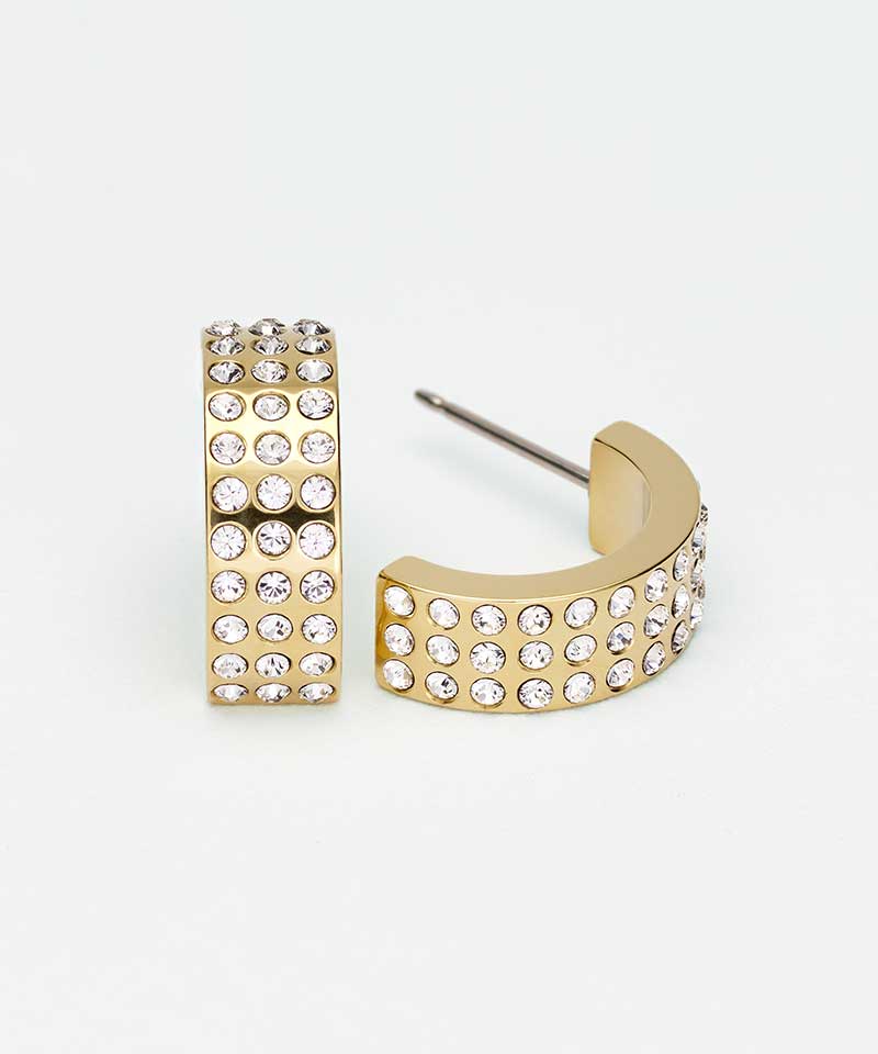 A pair of gold-toned hoop earrings embellished with rows of clear rhinestones, shown on a clean white background.