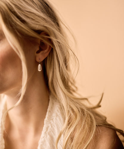 Drop Pearl Pendant in white, 15mm on model
