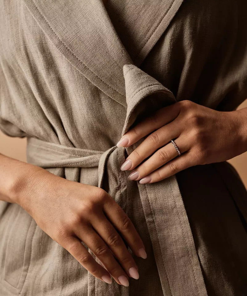 Model wearing Brilliance Curved Ring in Natural Titanium